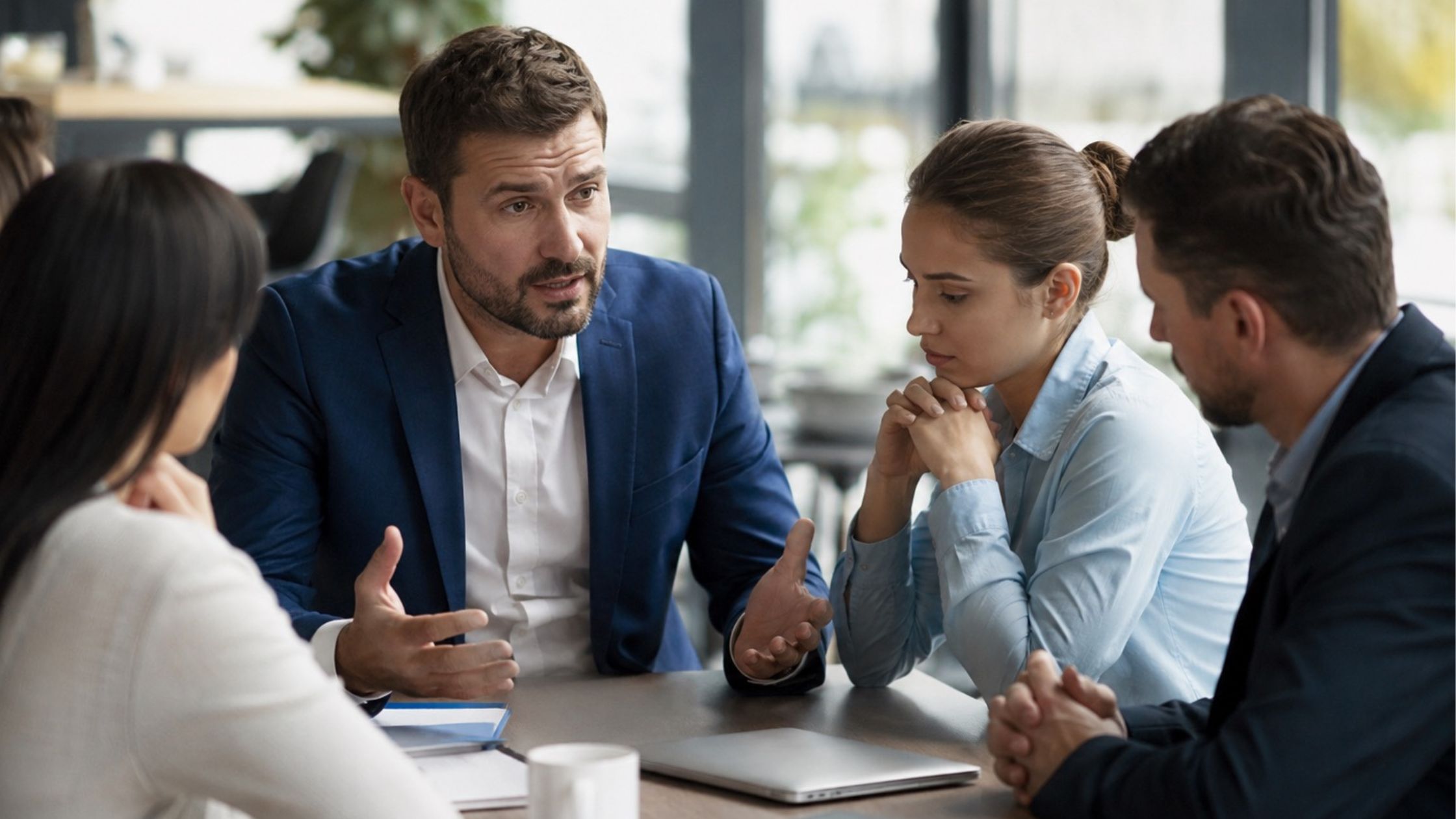 hotel manager taking responsibility during leadership meeting